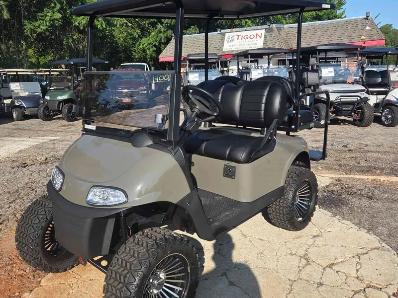 Used beige electric 2021 EZGO RXV lifted golf cart for sale in Raleigh, NC — photo 2