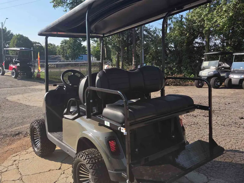 Used beige electric 2021 EZGO RXV lifted golf cart for sale in Raleigh, NC — photo 4