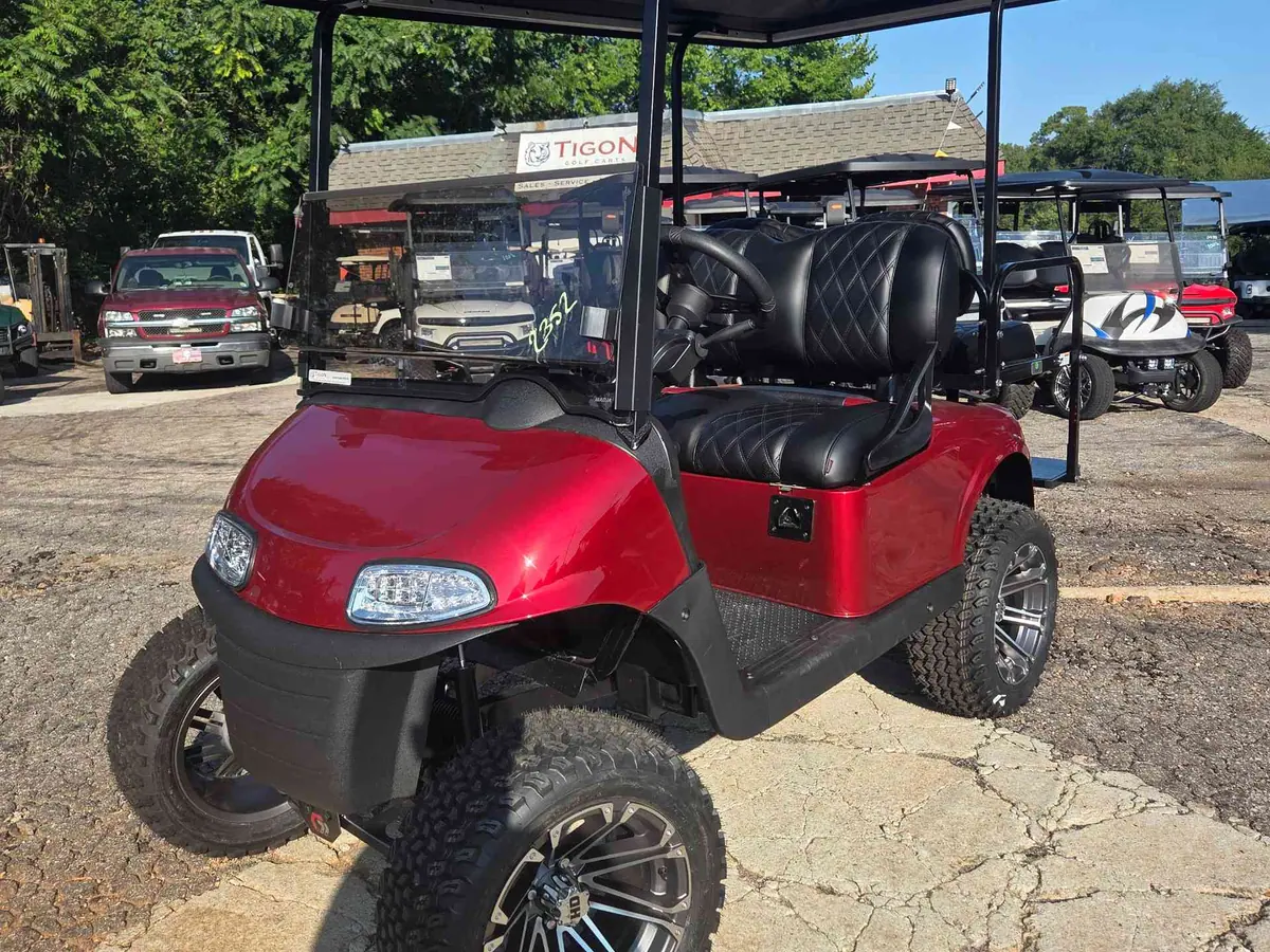 Used red electric 2021 EZGO RXV lifted golf cart for sale in Raleigh, NC