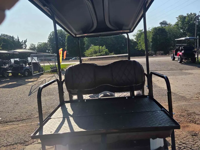 Used white electric 2021 EZGO RXV lifted golf cart for sale in Raleigh, NC — photo 5